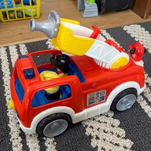 Little people fire truck. Girl and boy fire person and fire dog